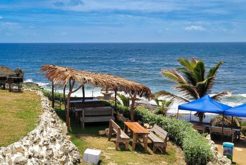 Thatched seating area above the sea on the east coast